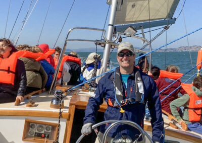 David G smiling at the helm of Pegasus