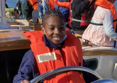Smiling Child at the Helm