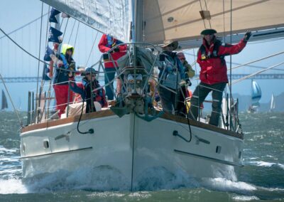 Pegasus sailing downwind wing on wing with volunteers aboard